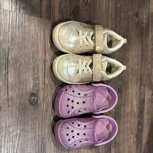 Kids gold sparkly shoes and purple sparkly crocs.